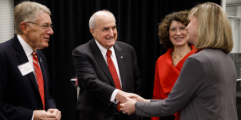 IU President McRobbie shakes hands 